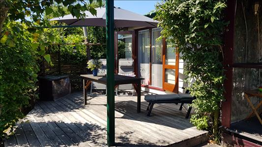 Vanaf € 320,-. Texel - Luxe Chalet (2 volwassenen, 2 kinderen) op schitterende locatie vlak bij bos en strand - "Ta Lème"