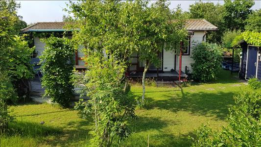 Vanaf € 320,-. Texel - Luxe Chalet (2 volwassenen, 2 kinderen) op schitterende locatie vlak bij bos en strand - "Ta Lème"